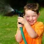 Kid with water hose