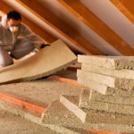 Man Laying Thermal Insulation Layer