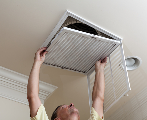 Changing an HVAC air filter in a Raleigh area home