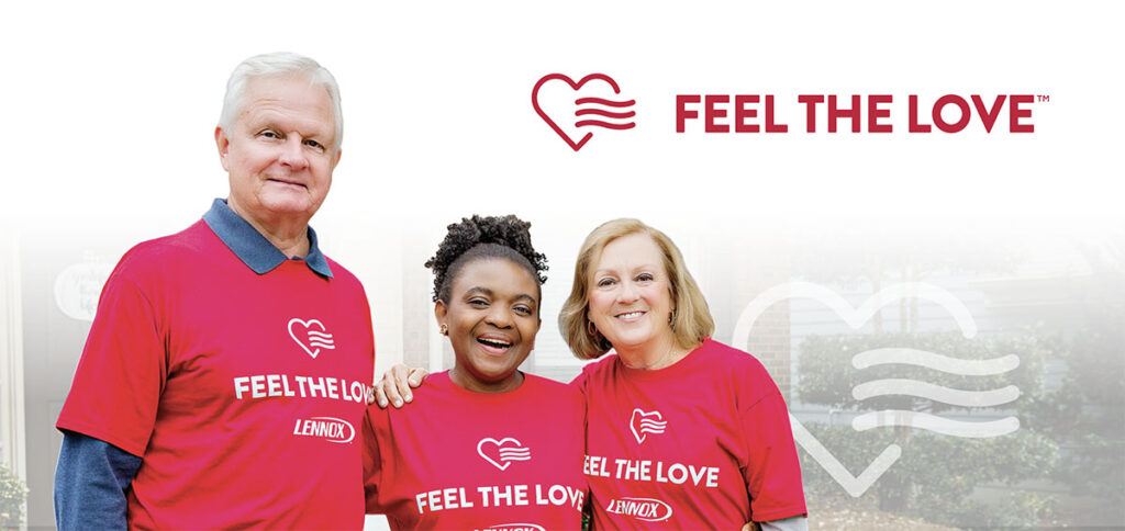 A man and two women stand together with Feel The Love t-shirts on