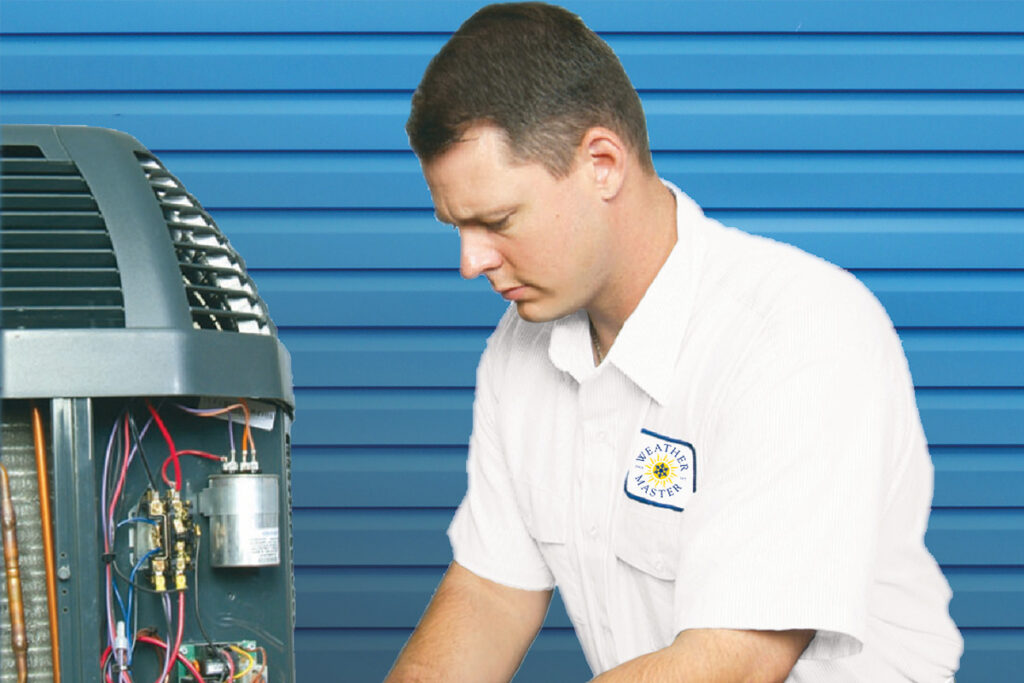 A Weather Master tech fixing an A/C unit